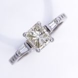 An 18ct white gold 0.75ct modified square brilliant-cut solitaire diamond ring, flanked by tapered