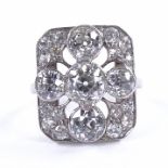 An Art Deco diamond cluster panel ring, circa 1920, geometric quatrefoil form set with old-cut