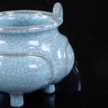 A Chinese pale blue crackle glaze porcelain censer with ring handles, rim diameter 10cm, height to