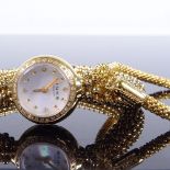 LINKS OF LONDON - a lady's gold plated stainless steel and silver Effervescence matching quartz