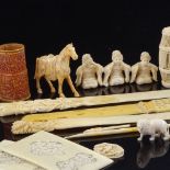A group of Chinese ivory paper knives, Japanese ivory figures, and other carvings