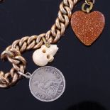 A 9ct gold curb link charm bracelet, with 9ct heart shape padlock and 3 charms, bracelet length