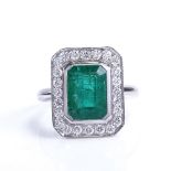 A modern 9ct white gold emerald and diamond cluster panel ring, in Art Deco style, total diamond