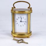 A French oval brass-cased carriage clock timepiece, white enamel dial with hand painted Deco