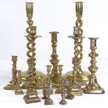 A collection of brass candlesticks, including a pair of open twist, height 30cm