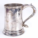 A George III provincial silver pint mug, plain tapering cylindrical form with banded rims, thumb