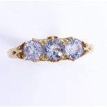 An early 20th century unmarked high carat gold 3-stone sapphire? half hoop ring, setting height 5.