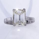 A 3ct emerald-cut solitaire diamond ring, set in a plain 4-claw platinum setting, clarity approx
