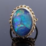 A late 20th century 9ct gold black opal doublet dress ring, setting height 21.5mm, size O, 4.2g Good