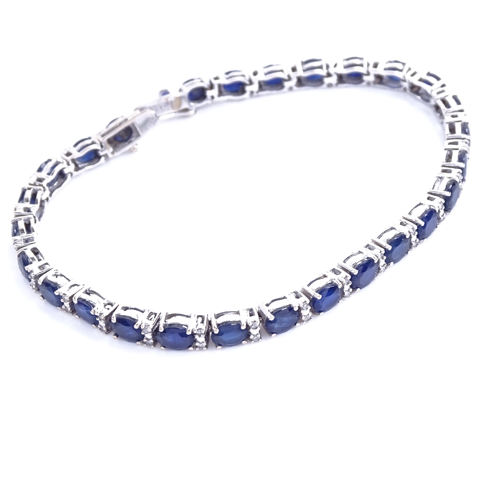 A modern 18ct white gold sapphire and diamond tennis line bracelet, total diamond content approx 0. - Image 2 of 5