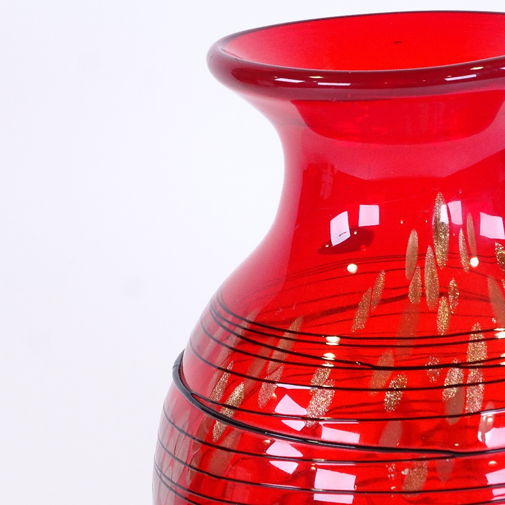 A large Murano red glass vase with black trail decoration, height 33cm Perfect condition