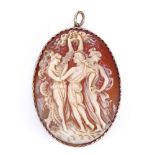 A relief carved shell cameo panel pendant, depicting The Three Graces, in unmarked gold frame,