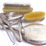 A German 9-piece silver-backed dressing table set, including hand mirror, hair brush, shoehorn etc