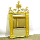 An ornate 19th century gilt-gesso framed wall mirror, with acanthus and dragon design finial,