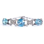 An 18ct white gold blue zircon and rose-cut diamond bracelet, Art Deco geometric form, set with