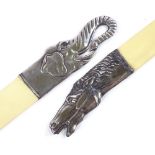 A pair of Russian silver-handled paper knives, with horse and elephant head decorated handles,