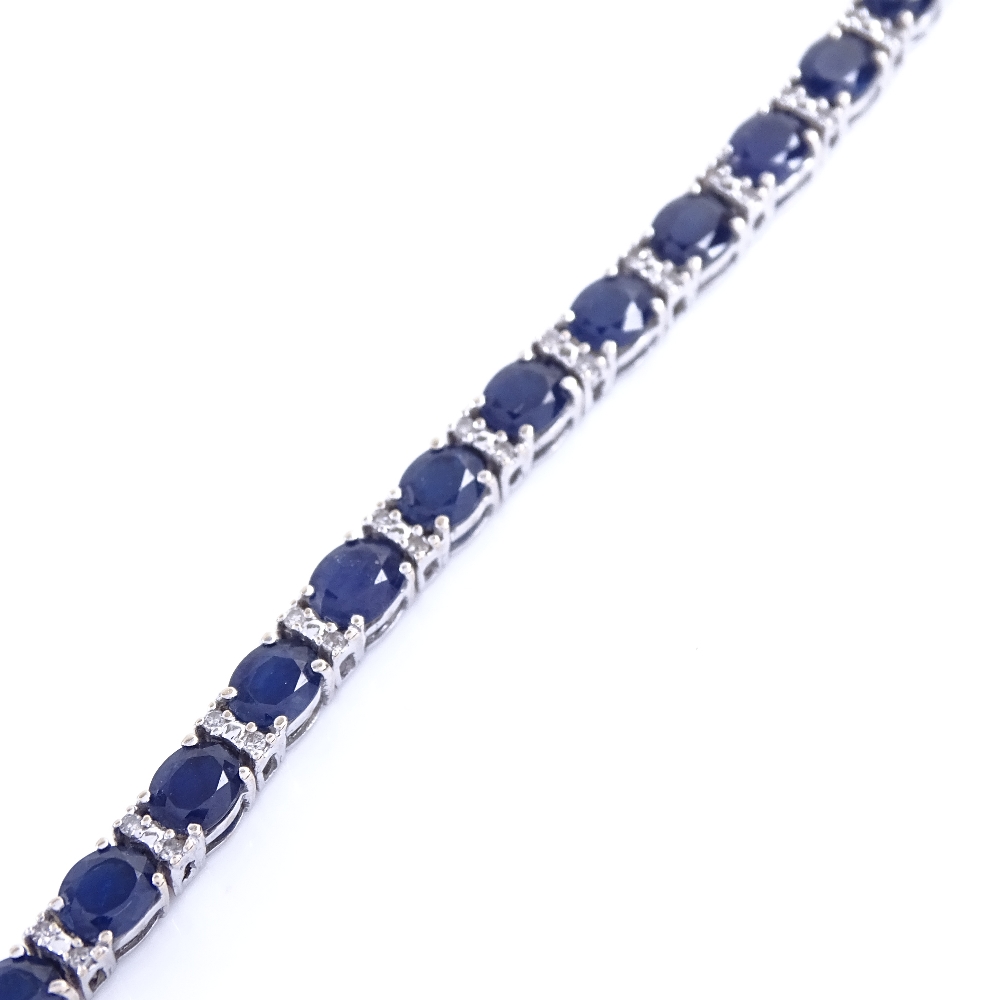 A modern 18ct white gold sapphire and diamond tennis line bracelet, total diamond content approx 0. - Image 5 of 5
