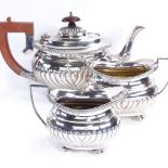 A late Victorian silver 3-piece tea set, comprising half fluted teapot, 2-handled sugar bowl and