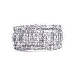 A modern sterling silver diamond cluster dress ring, set with baguette and round-cut diamonds,