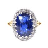 An oval sapphire and diamond cluster ring, circa 1915, central oval mixed-cut sapphire approx 5.