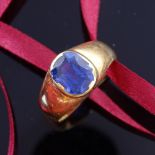 An early 20th century large unmarked high carat gold sapphire signet ring, setting height 12.3mm,