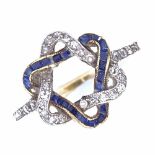 An early 20th century unmarked high carat gold sapphire and diamond dress ring, inverted intertwined