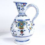 A Dutch Delft tin-glazed pottery ewer, height 26cm