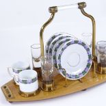 A German coffee and schnapps set, circa 1920s, transfer printed china and cut-glass on original