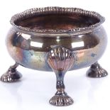 A George III Scottish silver salt cellar, gadrooned rim raised on 3 shell feet with engraved