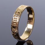 A Continental 14ct gold wedding band ring, inscribed Vous Et Nul Autre (You and No Other), band