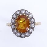 An 18ct gold citrine and diamond cluster ring, total diamond content approx 0.4ct, setting height