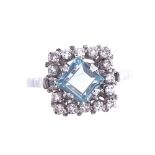 An early 20th century French 18ct white gold aquamarine and diamond cluster dress ring, setting