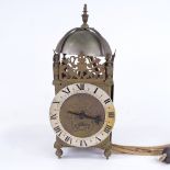 A late 19th/early 20th century brass-cased lantern clock, dial inscribed James Pool, silvered