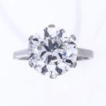 A 5.37ct solitaire diamond ring, the round brilliant-cut stone in plain 4-claw platinum setting,