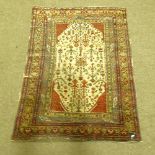 WITHDRAWN - An antique Persian rug with garden design, 172cm x 112cm.