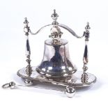 An electroplate table bell on stand, circa 1900, with original plated clapper, height 15.5cm, length