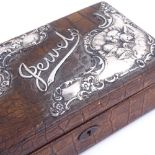 An Edwardian silver-mounted crocodile jewel box, relief embossed cherub and floral decoration, by