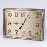 An Art Deco Swiss 8-day desk clock, brass frame with brushed brass dial and applied gilt Arabic