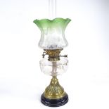A Victorian brass and cut-glass oil lamp, with etched frilled green glass shade, height to top of