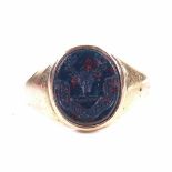 A 19th century unmarked gold bloodstone seal signet ring, intaglio carved stag-head emblem with
