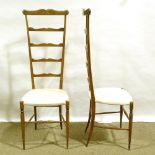 A pair of mid-century Italian Chiavari exaggerated high back chairs, with shaped ladder backs