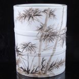 A Chinese white glaze porcelain brush pot, with painted bamboo design and text, height 14cm,