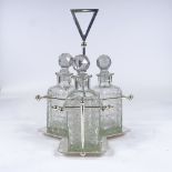 A set of 3 square cut-glass decanters on Aesthetic style electroplate stand, probably mid-20th