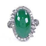 A cabochon jadeite and diamond cluster ring, set with large central cabochon jadeite, surrounded