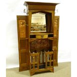 An impressive Liberty & Co Art Nouveau oak hall stand, circa 1910, with impressed copper panels,