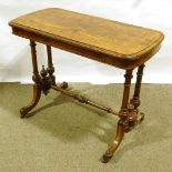 A Victorian burr-walnut centre standing stretcher table, with inlaid cross-banding and stringing,