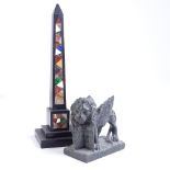 An Italian 19th century black marble and Pietra Dura inlaid obelisk, height 25cm, and a carved