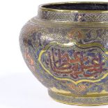 A large Islamic brass jardiniere, probably late 19th century with silver and copper inlaid