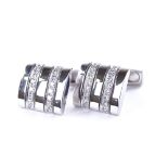 A pair of 18ct white gold diamond cufflinks, each rectangular panel set with a double-row of round