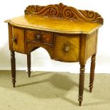 A Victorian mahogany bow-front sideboard of small size, with carved back, 3 frieze drawers and